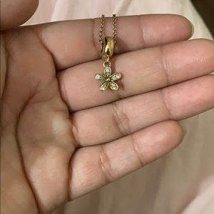 Pandora rose gold necklace with a daisy